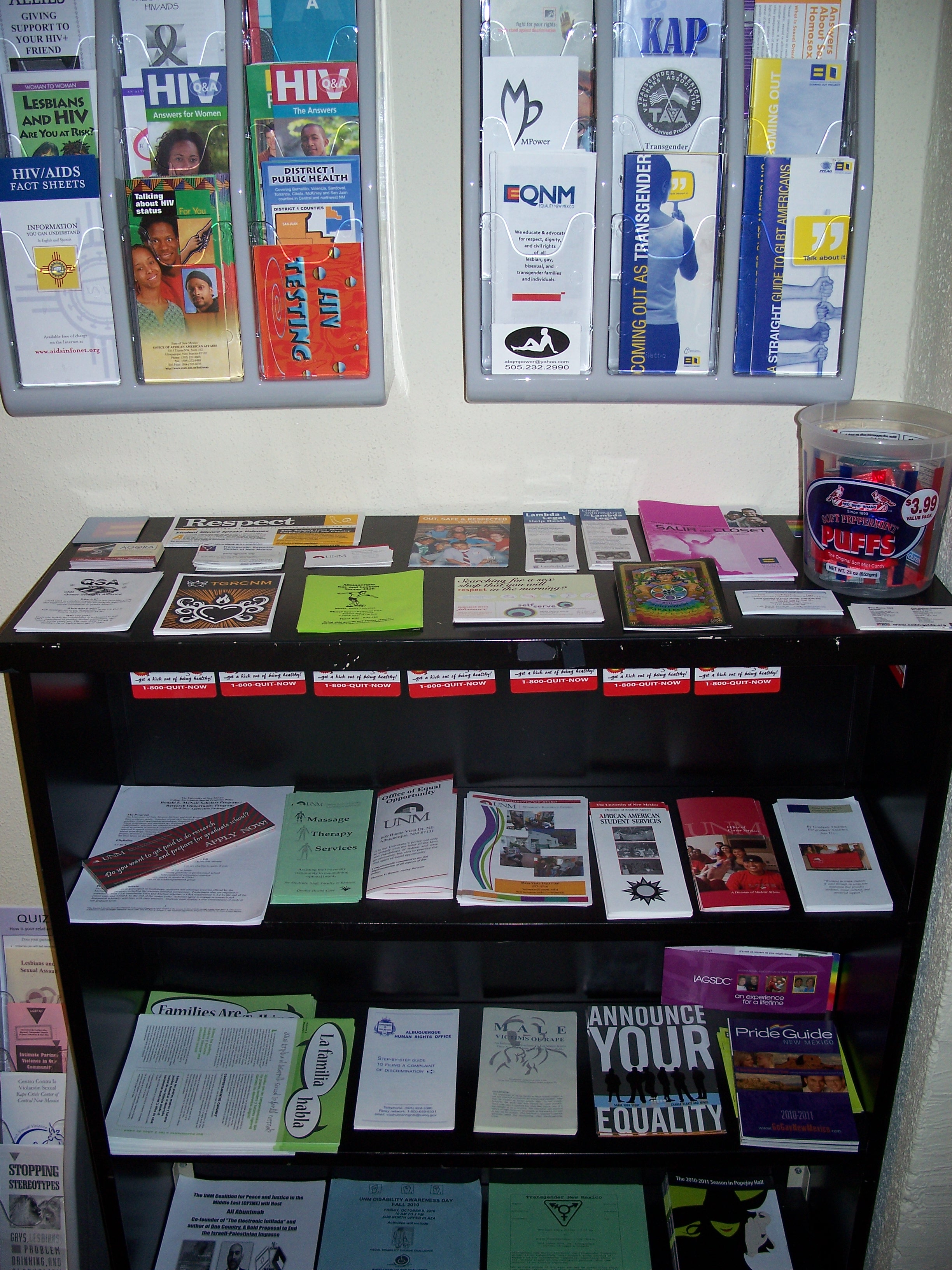 Photo of a bookshelf showing pamphlets and educational reading material